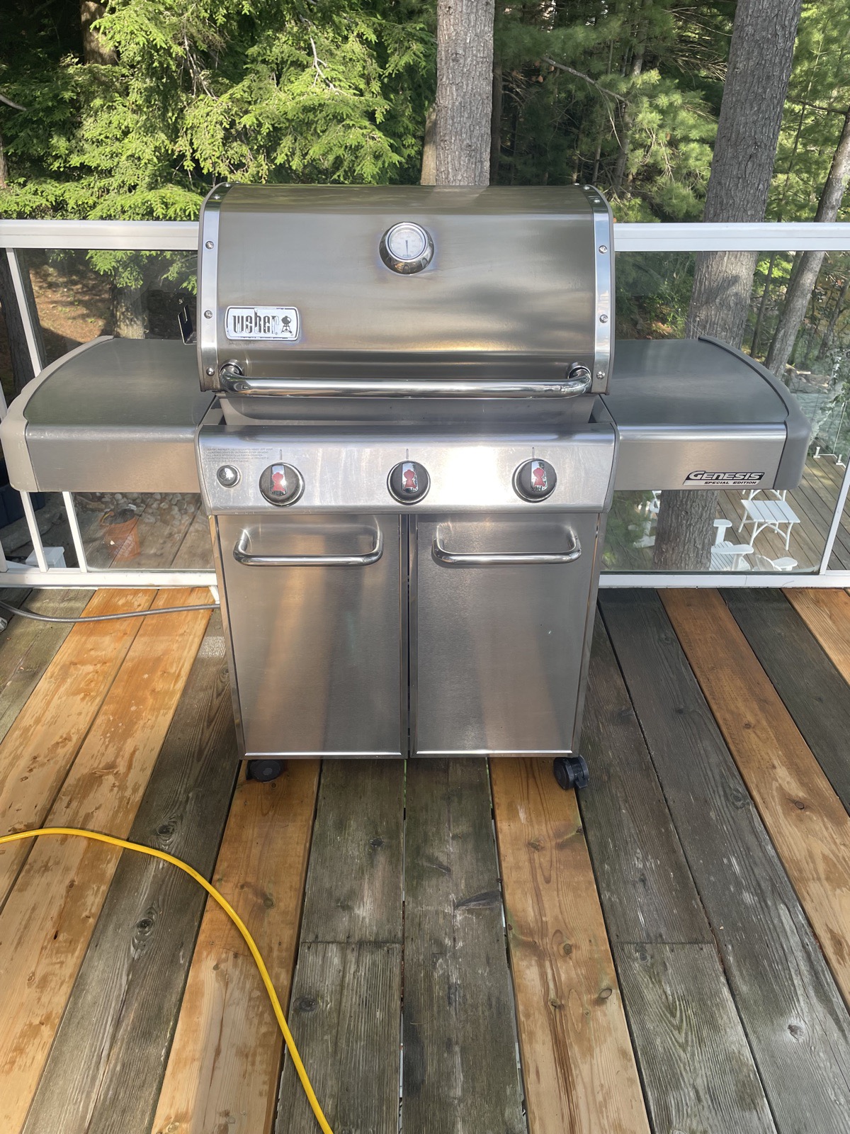 Weber BBQ cleaned and polished on a cottage deck